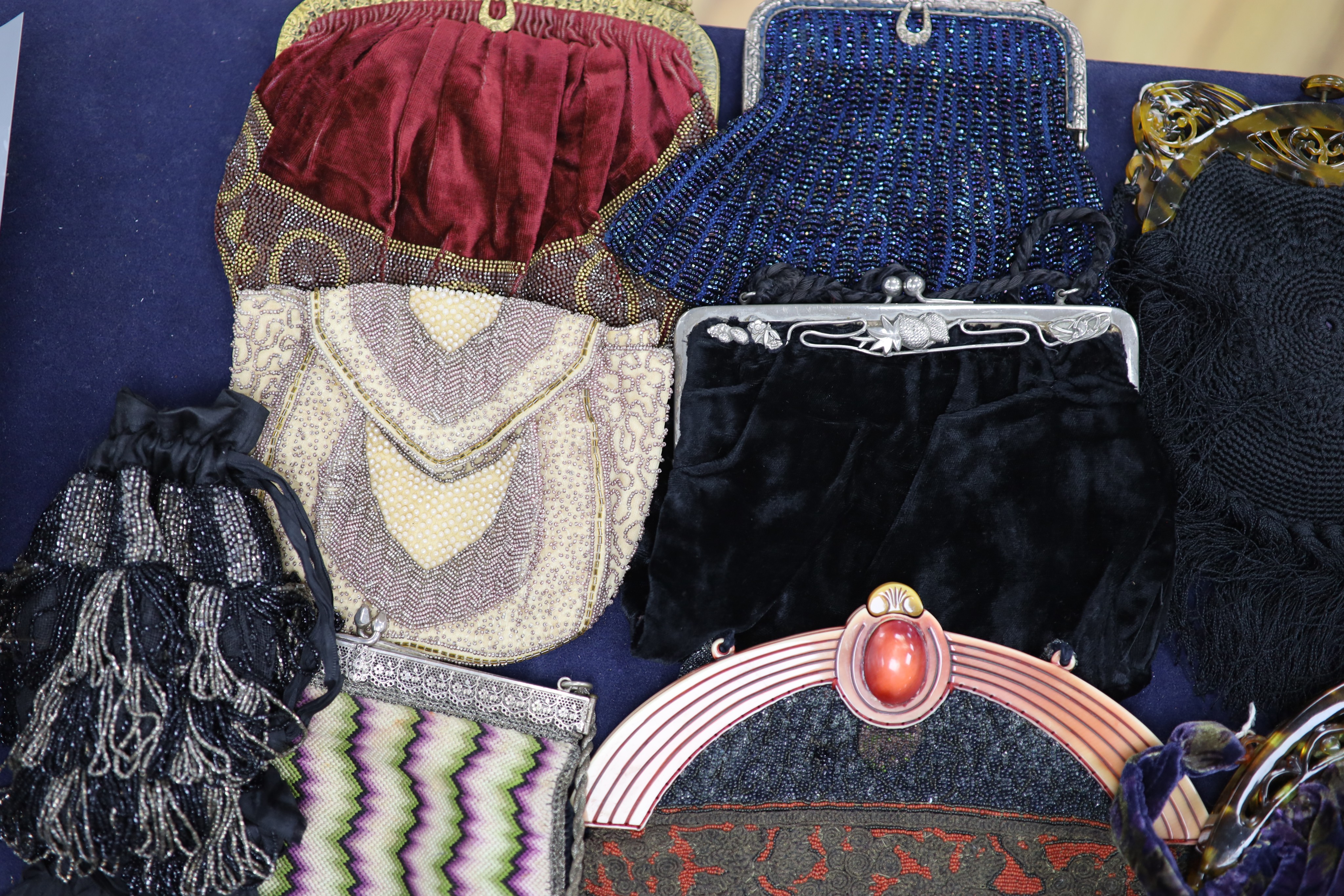 A collection of approximately fifty Victorian and later beadwork, white metal and fabric purses etc.